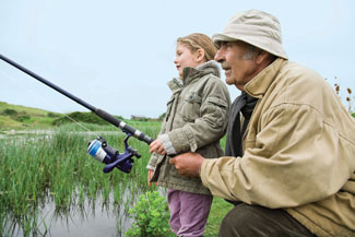 grandfather-fishing-with-granddaughter-stock-mar-5-2015